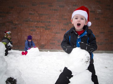 Four-year-old Wyatt Green works on a snowman before the 49th Annual Help Santa Toy Parade Saturday, November 17, 2018.  Ashley Fraser/Postmedia