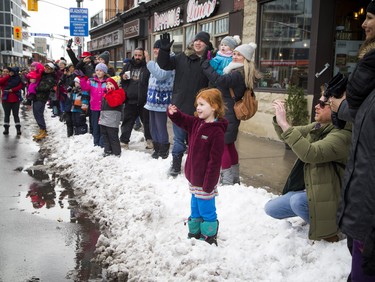 Youngsters lined the route, waving to the big guy during the 49th Annual Help Santa Toy Parade Saturday, November 17, 2018.  Ashley Fraser/Postmedia