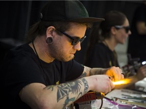 Local glass blower Drew Rankin, known in the glass world as Drewski, worked on a piece while people could watch at the second annual Cannabis & Hemp Expo at the Shaw Centre over the weekend.