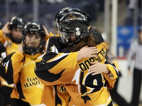 Team Manitoba celebrates after defeating Calgary Surge 3-1 to claim the gold medal in the U16 category of the 2018 canadian ringette championships in WInnipeg on April 14. Brook Jones/Postmedia