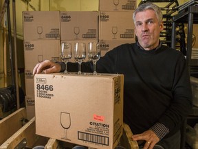 Edelweiss Party Rentals owner JR Chardon with the 9,000 or so wine glasses that are owned by the Ottawa Wine and Food Festival.