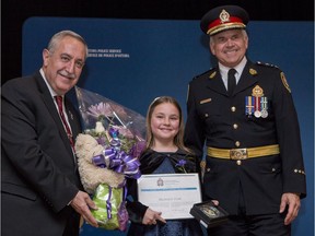 Mackenzie Vonk received the Ottawa Police Service Certificate of Merit from Chief Charles Bordeleau (R) and Ottawa Police Services Board Chair Eli El-Chantiry at the 2018 Community Police Awards Ceremony.