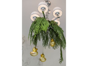 Gold duck German ornaments hanging under an umbrella of B.C. cedar add a touch of whimsy to the master ensuite.