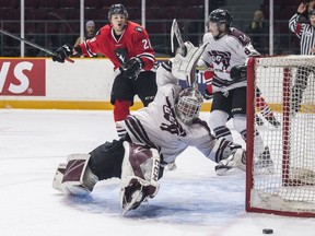 University of Ottawa Gee-Gees goaltender Anthony Brodeur goes down while the Carleton Ravens' Cody Caron (28) looks on in the Colonel By Classic at TD Place on Friday, Nov. 16, 2018. Errol McGihon/Postmedia