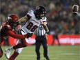 The football bounces away from Redblacks receiver Brad Sinopoli after a hit by Stampeders defensive back Jamar Wall in the fourth quarter of the Grey Cup game on Sunday. David Bloom/Postmedia