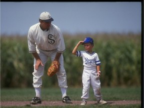 A "ghost player" recreating the role of Chicago White Sox legend Shoeless Joe Jackson plays ball with a young tourist at the baseball field created for the motion picture 'Field of Dreams' in Dyersville, Iowa, in 1991.