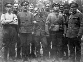 Gunners of the 68th Battery, R.C.A. with prisoners in Northern Russia, circa May 1919. Not all Canadians stopped fighting on Nov. 11, 1918.