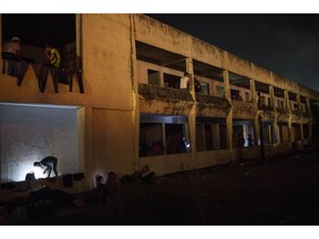 Central American migrants, part of a thousands-strong caravan hoping to reach the U.S., rest in an abandoned hotel in Matias Romero, Oaxaca state, Mexico, Thursday, Nov. 1, 2018. Thousands of migrants arrived in the town of Matias Romero after an exhausting 40-mile (65-kilometer) trek from Juchitan, Oaxaca, where they failed to get the bus transportation they had hoped for.