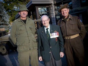 From left, reenactor Rob Clarke, Bill Black, president, Unit 7, Korea Veterans Association of Canada, and reenactor Colin Schlachta.