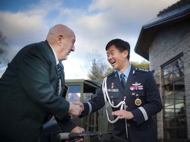 Les Peate, a Korea War veteran who was honoured during the special evening, speaks with Korean Colonel Chang Bae Yoon.