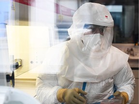 A doctor wearing protective gear.