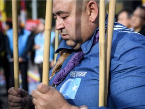 UIghur people demonstrate against China outside of the United Nations (UN) offices during the Universal Periodic Review of China by the UN Human Rights Council, on Tuesday in Geneva.