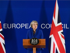 Britain's Prime Minister Theresa May gives a press conference after a special meeting of the European Council to endorse the draft Brexit withdrawal agreement and to approve the draft political declaration on future EU-UK relations on November 25, 2018 in Brussels.