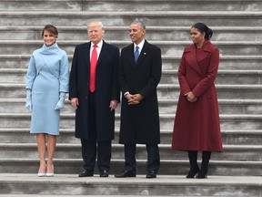 Donald Trump and Melania Trump. left, wait with former President Barack Obama, second right, and Michelle Obama before their departure from the US Capitol after Trump's inauguration ceremonies at the US Capitol in Washington, DC, on January 20, 2017.