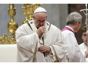 Pope Francis celebrates a mass in St. Peter basilica at the Vatican, Sunday, Nov. 18, 2018. Pope Francis is offering several hundred poor people, homeless, migrants, unemployed a lunch on Sunday as he celebrates the World Day of the Poor with a concrete gesture of charity in the spirit of his namesake, St. Francis of Assisi.