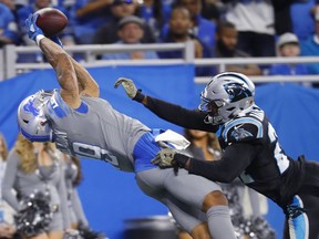 Detroit Lions wide receiver Kenny Golladay (19), defended by Carolina Panthers cornerback James Bradberry (24), catches a 19-yard pass for a touchdown during the second half of an NFL football game, Sunday, Nov. 18, 2018, in Detroit.