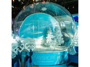Bayshore’s giant step-in snow globe is a bubble of serenity during bustling holiday shopping season.