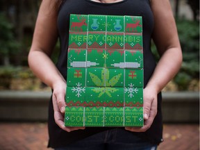 Lorilee Fedler, owner of Coast to Coast Medicinals, is pictured with her cannabis Christmas calendars in Vancouver, B.C., on Saturday November 25, 2017.