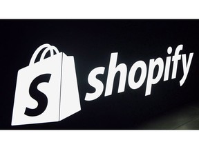 A Shopify logo is seen during an event in Toronto on May 8, 2018. Shopify Inc. says it has acquired Swedish e-commerce company Tictail. A spokesperson for Ottawa-based Shopify is refusing to share more details, but says the company periodically acquires organizations to bring specific talent and technology into the organization.
