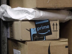 A package from Amazon Prime is loaded for delivery on a UPS truck, in New York on May 9, 2017. Amazon will split its second headquarters between Long Island City in New York and Crystal City in northern Virginia, according to a person familiar with the plans.