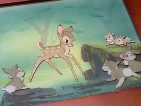 A framed animation drawing from the movie "Bambi" is seen in this undated handout photo. A homeless man who found an authentic animation cell from the classic Disney movie "Bambi" in a tattered, dirty frame will use his earnings to reunite with his family in Ontario.