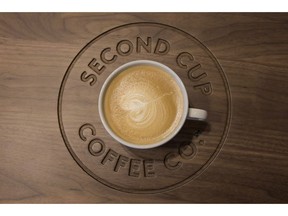 A detail shot of a flat white coffee at a Second Cup Coffee outlet in Toronto on December 4, 2014. A group of current and past Second Cup Ltd. franchisees has filed a lawsuit against the Canadian coffee chain. The suit filed earlier this month in the Superior Court of Quebec alleges the company improperly used money franchisees must pay into an advertising fund, forced franchisees to acquire debt to fund equipment that failed to boost sales, and failed to take action to make up market share lost to other coffee chains, in particular Starbucks -- among other things.