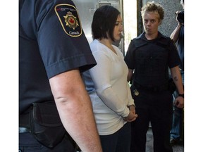 Terri-Lynne McClintic, convicted in the death of 8-year-old Woodstock, Ont., girl Victoria Stafford, is escorted into court in Kitchener, Ont., on Wednesday, September 12, 2012 for her trial in an assault on another inmate while in prison. Newly released figures show the practice of placing child killers in the federal prison service's Indigenous healing lodges stretches back several years - well before the recent uproar over McClintic.THE CANADIAN PRESS/ Geoff Robins