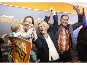 Alberta NDP Leader Rachel Notley (centre), Calgary East candidate Robyn Luff and her daughter Vesper, eight-months-old, and Calgary-Fort NDP candidate Joe Ceci attend a campaign event at Ceci's campaign headquarters in Calgary, Wednesday, April 8, 2015. A backbencher in Notley's NDP says she won't take her seat in the legislature to draw attention to what she calls a "toxic culture" in the governing caucus.
