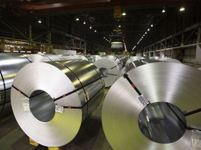 Rolls of coiled coated steel are shown at Stelco in Hamilton, Ont., on June 29, 2018. If the midterm elections were supposed to wipe clear the uncertainty of tariffs, trade and other smudges on the window into Canada-U.S. affairs, well, have a look at the bizarro world of politics in the United States of America. A Democratic majority in the House of Representatives was "very close to complete victory" for President Donald Trump. The election is both over and not over, thanks to vote-counting disputes in Florida, Georgia and Arizona. There's a new trade deal, but the White House and Canada are still staring each other down over steel and aluminum.