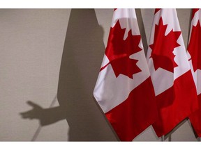 The federal government will release a fall economic update later today that will seek to close the loop on some of its outstanding mandate commitments, sources say, leaving the door open for the Liberals to use next year's budget as their 2019 election platform. Federal Finance Minister Bill Morneau's shadow is cast upon the backdrop as he addresses journalists in Toronto on Thursday, Aug. 30, 2018.