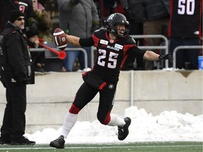 Ottawa Redblacks Brendan Gillanders (25) celebrates a touchdown during second half CFL East Division final action against the Hamilton Tiger-Cats, in Ottawa on Sunday.