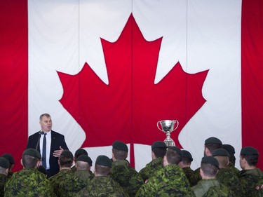 CFL commissioner, Randy Ambrosie addresses members of the Canadian Armed Forces after the Grey Cup arrived at CFB Edmonton on Tuesday.