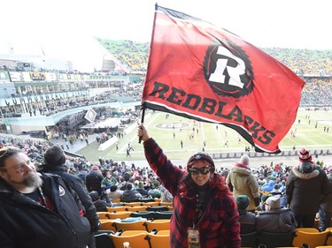 A football fan is seen ahead of the 106th Grey Cup between the Calgary Stampeders and Ottawa Redblacks at Commonwealth Stadium in Edmonton, Sunday, November 25, 2018.