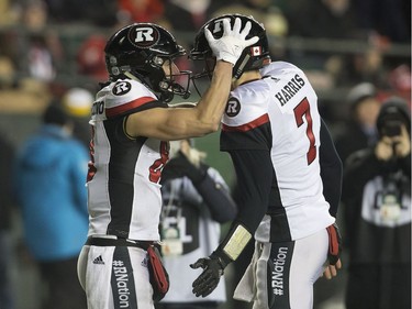 Ottawa Redblacks wide receiver Julian Feoli-Gudino (83) celebrates his touchdown with quarterback Trevor Harris (7) during the first half of the 106th Grey Cup against the Calgary Stampeders in Edmonton, Sunday, November 25, 2018.