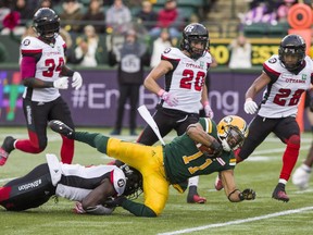 Ottawa Redblacks' Chris Ackie (5) tackles the Edmonton Eskimos' Nate Behar (11) as Kyries Hebert (34) and other teammates look on. Between the WILL (weakside) and MIKE (middle) linebacker spots, the Redblacks have four guys — Kevin Brown, Avery Williams, Hebert and Ackie — who can each play at a high level.