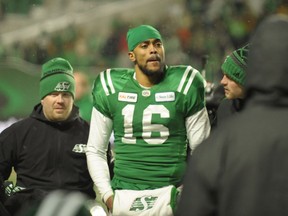 Roughriders quarterback Brandon Bridge is accompanied off the field after taking an unpenalized hit to the helmet from the Blue Bombers' Jackson Jeffcoat in the CFL West Division semifinal on Sunday.