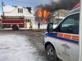 Firefighters and paramedics work at the scene of one of two fires in Eganville on Wednesday, Nov. 21, 2018. Renfrew Paramedics.