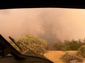 A screen grab of video filmed from inside the helicopter as it rescued people from a California mountain.