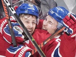 Montreal Canadiens' Tomas Tatar (90) celebrates with teammate Brendan Gallagher after scoring during third period NHL hockey action against the Vegas Golden Knights, in Montreal, Saturday, Nov. 10, 2018.