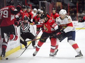 Senators centre Matt Duchene (95) fights to protect the puck against Panthers centre Nick Bjugstad (27) during the second period of Monday's game.