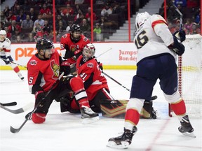 Florida centre Aleksander Barkov, right, blasts the puck past Ottawa netminder Craig Anderson (41) and defenceman Cody Ceci for a goal during the first period of Monday's game at Canadian Tire Centre. Anderson was replaced by Mike McKenna after allowing six goals.