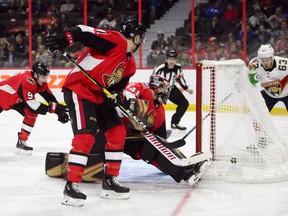 Florida Panthers right wing Evgenii Dadonov (63), right, scores a goal on Ottawa Senators goaltender Craig Anderson (41) during first period NHL hockey action in Ottawa on Monday night.