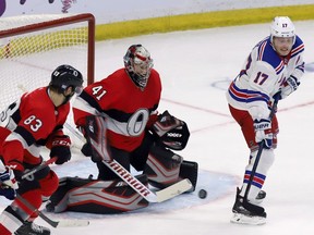 Ottawa Senators goaltender Craig Anderson keeps his eye on the puck as the New York Rangers' Jesper Fast attempts to deflect the puck on Thursday, Nov. 29, 2018.