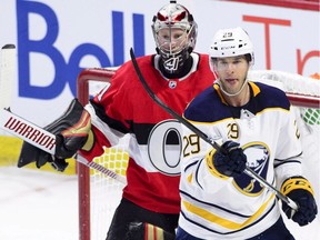 Ottawa Senators goaltender Craig Anderson (41) defends his net against Buffalo Sabres right wing Jason Pominville (29) during first period NHL hockey action in Ottawa on Thursday, Nov. 1, 2018.