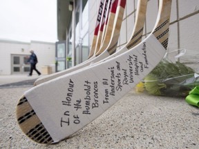 Hockey sticks are seen outside the Elgar Petersen Arena in Humboldt, Sask.