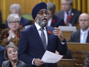 Minister of National Defence Harjit Sajjan rises during Question Period in the House of Commons on Parliament Hill in Ottawa on Monday, Nov. 5, 2018.