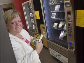 Maria McRae, then city councillor for River ward, poses for a photo with the first Ottawa Public Library vending machine installed at the Hunt Club-Riverside Park Community Centre in July 2010. Chris Mikula/Postmedia files