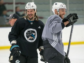 San Jose Shark Erik Karlsson, left, has a laugh with Barclay Goodrow during practice at the University of Ottawa athletic facility in advance of his first game against his old team, the Ottawa Senators, at Canadian Tire Centre on Saturday.