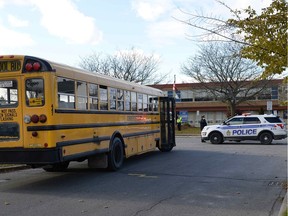 Police work outside École Élémentaire Catholique Lamoureux after children were exposed to an unknown substance on the school bus, in Ottawa on Thursday, November 8, 2018. Justin Tang
