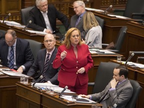 Lisa MacLeod, Ontario's Minister of Children, Community and Social Services stands in the Legislature during question period ahead of making an announcement on the Government's social assistance reform, in Toronto, on Nov. 22, 2018.